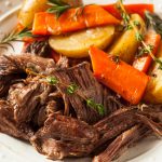 roast beef dinner with carrots and potatoes