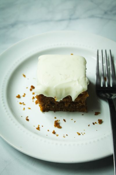 pumpkin bars with cream cheese frosting on a plate